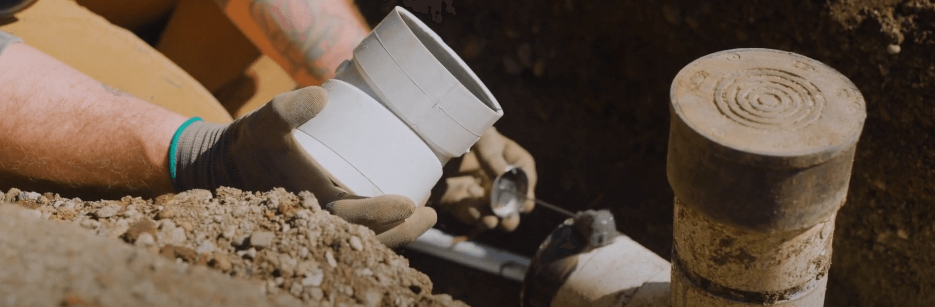 Close up of perimeter drain pipe installation